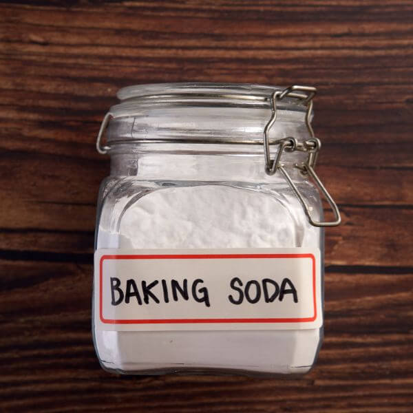 Sprinkle baking soda overnight to remove dog urine stain and odor from hardwood floors
