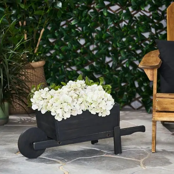 Feature a Rustic Wheelbarrow Planter