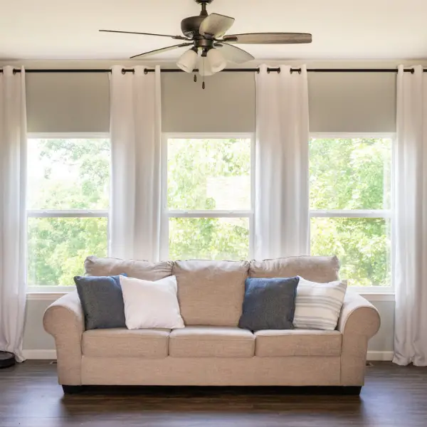Make Living Room Look Bigger with Larger Curtains